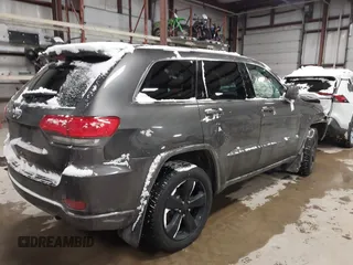 2015 Jeep Grand Cherokee Laredo with VIN 1C4RJFAGXFC752489, listed as a IAAI auction lot 41382389 with 147,892 mi miles. Bid and sale history available at carsss.com. Image 4.