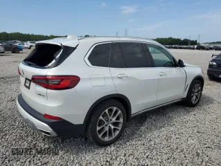 2019 BMW X5 xDrive40i with VIN 5UXCR6C5XKLK80703, listed as a Copart auction lot 63473495 with 57,260 mi miles and Salvage title. Bid and sale history available at DreamBid. Image 3.