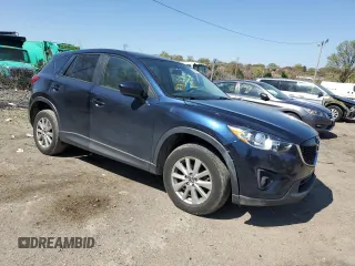 2014 Mazda CX-5 Touring with VIN JM3KE4CY4E0407868, listed as a Copart auction lot 52564315 with 137,989 mi miles and Salvage Title. Bid and sale history available at carsss.com. Image 4.