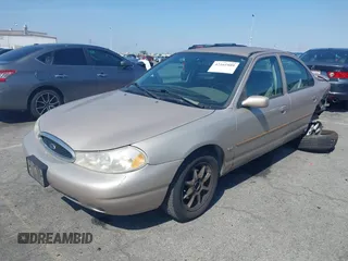 1999 Ford Contour z VIN 3FAFP66L6XM102099, wystawiony jako IAAI lot #42161889 z przebiegiem 100 340 mil mil oraz . Historia ofert i sprzedaży dostępna na DreamBid. Obrazek 2.