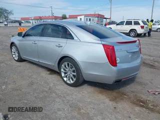 2016 Cadillac XTS Luxury Collection z VIN 2G61M5S33G9107107, wystawiony jako IAAI lot #42072608 z przebiegiem 130 542 mil mil oraz . Historia ofert i sprzedaży dostępna na DreamBid. Obrazek 3.
