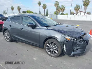2018 Mazda 3 Touring with VIN 3MZBN1L32JM268582, listed as a IAAI auction lot 42072435 with 61,417 mi miles. Bid and sale history available at carsss.com. Image 1.