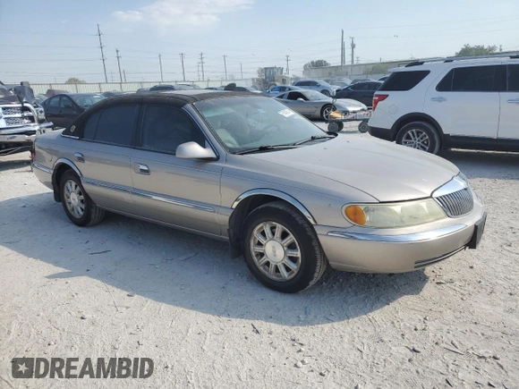 2002 Lincoln Continental with VIN 1LNHM97V32Y647800, listed as a Copart auction lot 75240874 with 71,689 mi miles and Salvage Title. Bid and sale history available at carsss.com. Image 4.