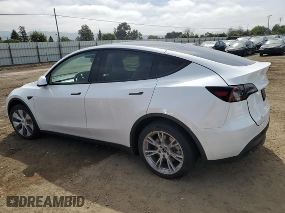 2023 Tesla Model Y Long Range z VIN 7SAYGDEE3PF815088, wystawiony jako Copart lot #54849895 z przebiegiem 19 637 mil mil oraz Szkoda całkowita • Salvage title. Historia ofert i sprzedaży dostępna na DreamBid. Obrazek 2.
