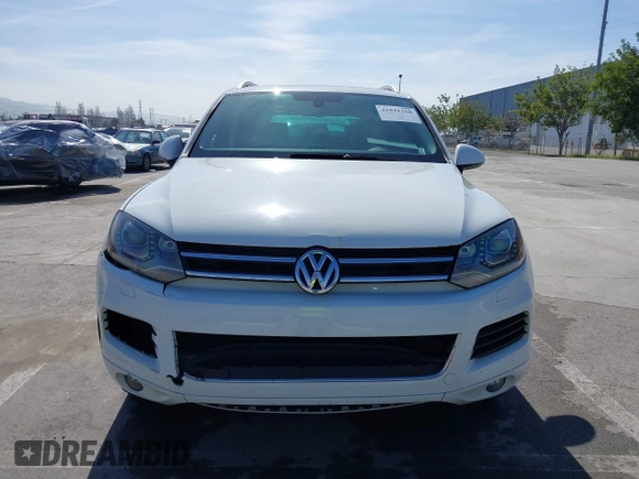 2012 Volkswagen Touareg Sport with VIN WVGEF9BP5CD007294, listed as a IAAI auction lot 41841268 with 160,883 mi miles and . Bid and sale history available at DreamBid. Image 12.