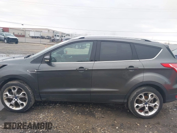 2015 Ford Escape Titanium with VIN 1FMCU9J94FUB49236, listed as a IAAI auction lot 42117378 with 112,267 mi miles. Bid and sale history available at carsss.com. Image 15.