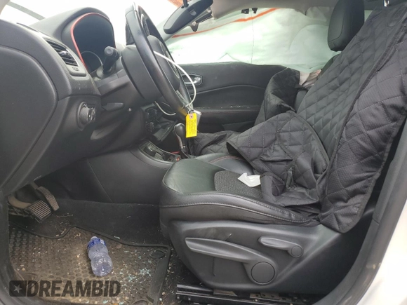 2019 Jeep Compass Trailhawk with VIN 3C4NJDDB5KT671613, listed as a Copart auction lot 61023125 with 64,793 mi miles and Salvage title. Bid and sale history available at DreamBid. Image 7.