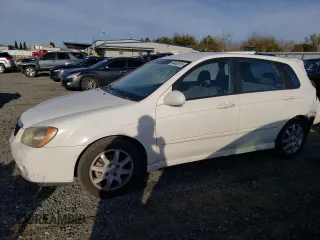 2006 Kia Spectra with VIN KNAFE162765223719, listed as a Copart auction lot 49452815 with 206,870 mi miles and Salvage Title. Bid and sale history available at carsss.com. Image 1.