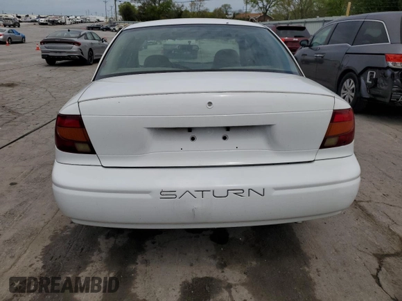 2002 Saturn SL z VIN 1G8ZH52842Z136222, wystawiony jako Copart lot #53687125 z przebiegiem 133 327 mil mil oraz Szkoda całkowita • Salvage title. Historia ofert i sprzedaży dostępna na DreamBid. Obrazek 6.