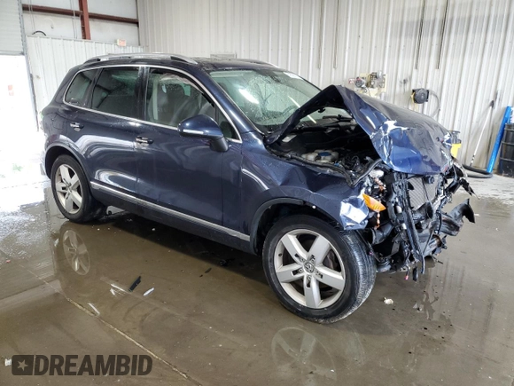 2014 Volkswagen Touareg Sport with VIN WVGEF9BP2ED002718, listed as a Copart auction lot 59526575 with 194,480 mi miles and Non repairable. Bid and sale history available at DreamBid. Image 4.