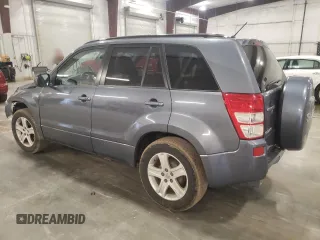 2007 Suzuki Grand Vitara Luxury z VIN JS3TD947774200407, wystawiony jako Copart lot #52001965 z przebiegiem Nie podano mil oraz Szkoda całkowita • Salvage title. Historia ofert i sprzedaży dostępna na DreamBid. Obrazek 2.