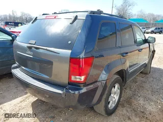 2010 Jeep Grand Cherokee Laredo with VIN 1J4PS4GK0AC112654, listed as a IAAI auction lot 41809445 with 418,301 mi miles. Bid and sale history available at carsss.com. Image 4.
