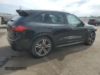 2013 Porsche Cayenne GTS с VIN WP1AD2A29DLA72323, выставлен на аукционе Copart как лот 52990885 с пробегом 100 812 миль миль и Списание • Salvage title. История ставок и продаж доступна на DreamBid. Изображение 3.