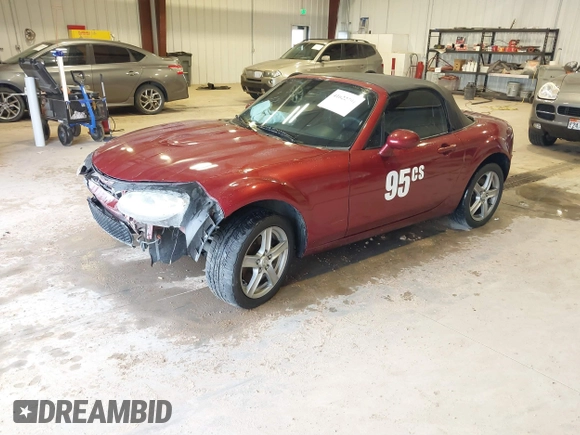 2007 Mazda MX-5 Miata Sport z VIN JM1NC25F970132299, wystawiony jako IAAI lot #41622791 z przebiegiem 72 392 mil mil oraz . Historia ofert i sprzedaży dostępna na DreamBid. Obrazek 2.