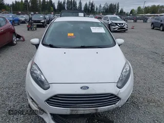 2016 Ford Fiesta S z VIN 3FADP4TJ8GM193620, wystawiony jako IAAI lot #42131839 z przebiegiem 155 664 mil mil oraz . Historia ofert i sprzedaży dostępna na DreamBid. Obrazek 13.