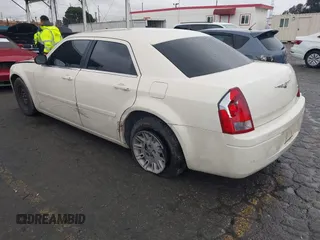 2006 Chrysler 300 with VIN 2C3KA43RX6H470150, listed as a IAAI auction lot 41767272 with 107,457 mi miles. Bid and sale history available at carsss.com. Image 3.