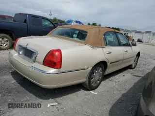 2003 Lincoln Town Car Cartier z VIN 1LNHM83W33Y690270, wystawiony jako Copart lot #51682235 z przebiegiem 118 355 mil mil oraz Szkoda całkowita • Salvage title. Historia ofert i sprzedaży dostępna na DreamBid. Obrazek 3.