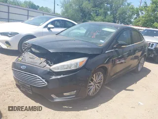 2015 Ford Focus Titanium with VIN 1FADP3J24FL385526, listed as a IAAI auction lot 42011712 with 162,696 mi miles and . Bid and sale history available at carsss.com. Image 2.