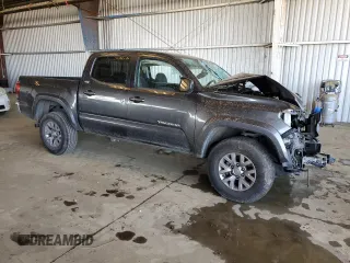 2018 Toyota Tacoma SR5 with VIN 3TMAZ5CN9JM075289, listed as a Copart auction lot 52409365 with 65,793 mi miles and Salvage Title. Bid and sale history available at DreamBid. Image 4.