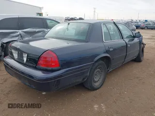 2001 Ford Crown Victoria Police Police Interceptor with VIN 2FAFP71W01X198332, listed as a IAAI auction lot 41474334 with 141,148 mi miles. Bid and sale history available at carsss.com. Image 4.