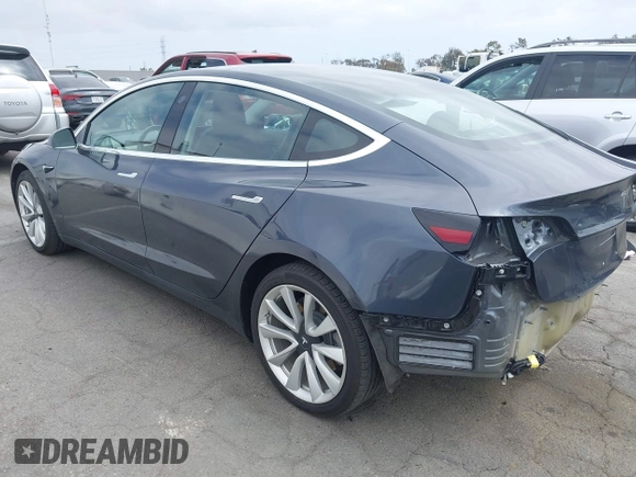 2018 Tesla Model 3 Long Range Battery with VIN 5YJ3E1EA8JF059385, listed as a IAAI auction lot 42116589 with 63,630 mi miles and . Bid and sale history available at DreamBid. Image 3.
