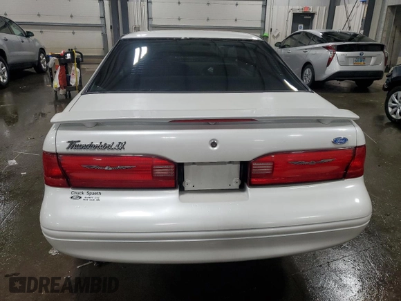 1997 Ford Thunderbird LX with VIN 1FALP6249VH167869, listed as a Copart auction lot 86851434 with 40,490 mi miles and Salvage Title. Bid and sale history available at DreamBid. Image 6.