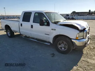 2003 Ford F-350 XL with VIN 1FTSW30F63EB07672, listed as a Copart auction lot 76659184 with 243,580 mi miles and Salvage Title. Bid and sale history available at DreamBid. Image 4.