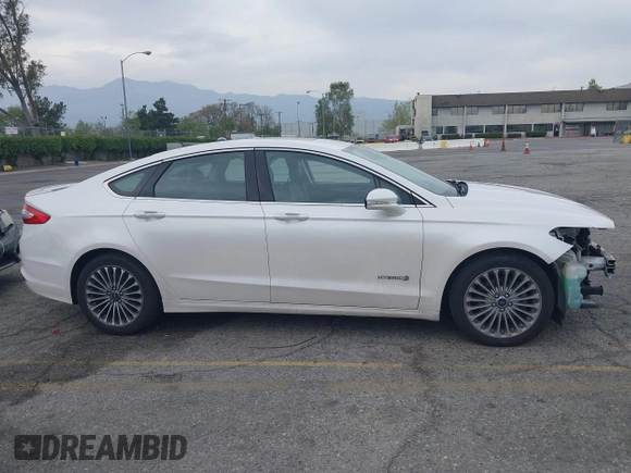 2013 Ford Fusion Titanium Hybrid with VIN 3FA6P0RUXDR386675, listed as a IAAI auction lot 42013986 with 89,349 mi miles. Bid and sale history available at carsss.com. Image 14.