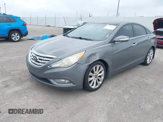 2013 Kia Optima EX with VIN 5XXGN4A75DG148460, listed as a IAAI auction lot 42414837 with 163,999 mi miles and . Bid and sale history available at DreamBid. Image 2.
