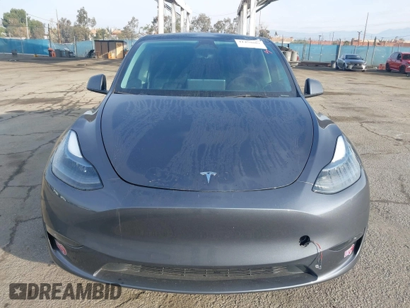 2023 Tesla Model Y Long Range with VIN 7SAYGDEE7PA196038, listed as a IAAI auction lot 41459601 with 16,489 mi miles and . Bid and sale history available at DreamBid. Image 12.