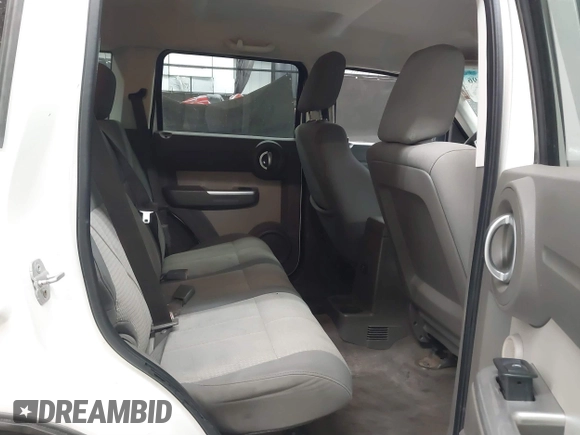 2007 Dodge Nitro SLT with VIN 1D8GU58K97W583408, listed as a IAAI auction lot 41653696 with 124,449 mi miles. Bid and sale history available at carsss.com. Image 8.