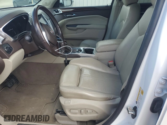 2014 Cadillac SRX Premium Collection z VIN 3GYFNGE32ES573872, wystawiony jako Copart lot #49871955 z przebiegiem 119 362 mil mil oraz Szkody całkowita. Historia ofert i sprzedaży dostępna na DreamBid. Obrazek 7.
