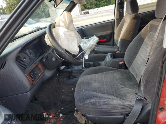 1996 Jeep Grand Cherokee z VIN 1J4EZ58Y5TC142263, wystawiony jako Copart lot #70532894 z przebiegiem Nie podano mil oraz Szkoda całkowita • Salvage title. Historia ofert i sprzedaży dostępna na DreamBid. Obrazek 7.
