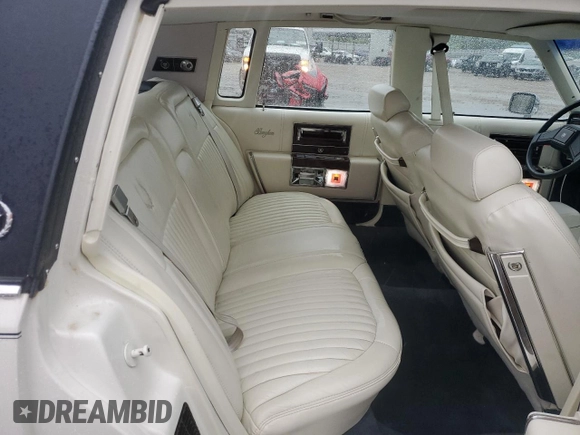 1992 Cadillac Brougham with VIN 1G6DW54E5NR708009, listed as a Copart auction lot 56849345 with 83,203 mi miles and Salvage title. Bid and sale history available at DreamBid. Image 10.