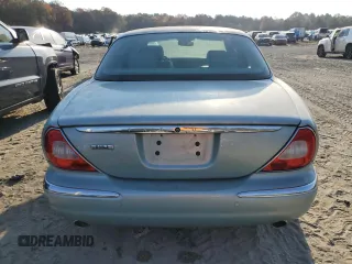 2005 Jaguar XJ with VIN SAJWA79C15SG48962, listed as a Copart auction lot 75674034 with 0 mi miles and Salvage Title. Bid and sale history available at carsss.com. Image 6.
