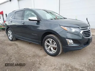 2021 Chevrolet Equinox Premier z VIN 2GNAXXEV0M6129843, wystawiony jako IAAI lot #41136835 z przebiegiem 67 723 mil mil oraz . Historia ofert i sprzedaży dostępna na DreamBid. Obrazek 1.