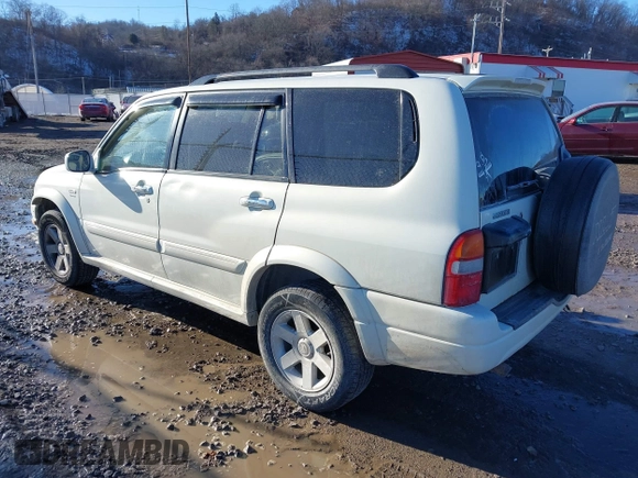2003 Suzuki XL7 Touring z VIN JS3TX92V734100178, wystawiony jako IAAI lot #41386492 z przebiegiem 91 912 mil mil oraz . Historia ofert i sprzedaży dostępna na DreamBid. Obrazek 3.