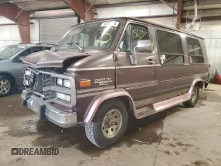 1992 Chevrolet Chevy Van z VIN 2GBEG25K3N4150299, wystawiony jako Copart lot #74099444 z przebiegiem 156 341 mil mil oraz Tytuł czysty. Historia ofert i sprzedaży dostępna na DreamBid. Obrazek 1.