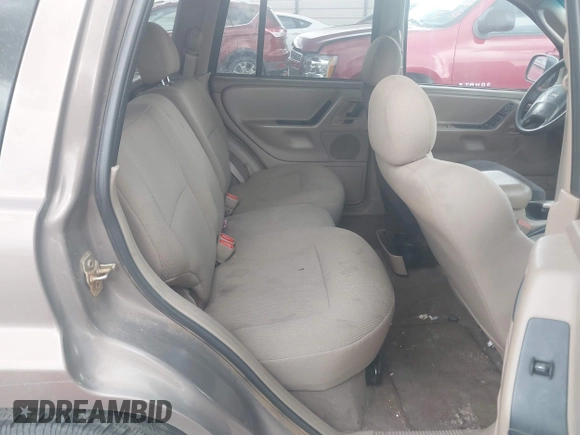 2002 Jeep Grand Cherokee Laredo with VIN 1J4GX48S32C168105, listed as a IAAI auction lot 42451373 with 293,790 mi miles and . Bid and sale history available at DreamBid. Image 8.