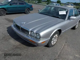 2000 Jaguar XJ with VIN SAJDA14C4YLF13470, listed as a IAAI auction lot 42136313 with 237,063 mi miles and . Bid and sale history available at DreamBid. Image 2.