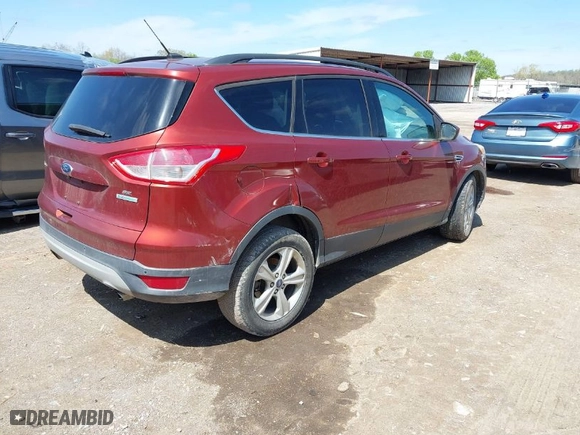 2014 Ford Escape SE with VIN 1FMCU0GX0EUB54675, listed as a IAAI auction lot 41865057 with 145,632 mi miles. Bid and sale history available at carsss.com. Image 4.
