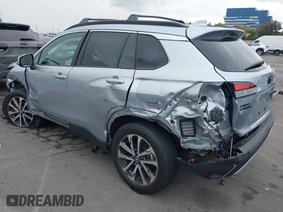 2023 Toyota Corolla Cross XLE with VIN 7MUEAABG8PV077117, listed as a IAAI auction lot 42052305 with 21,571 mi miles and . Bid and sale history available at DreamBid. Image 3.