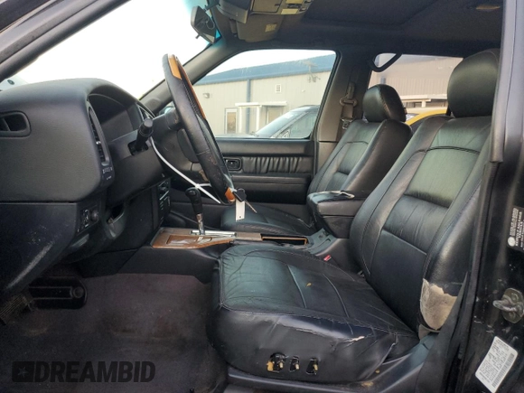 2002 Infiniti QX4 with VIN JNRDR09X92W210247, listed as a Copart auction lot 84913164 with 160,938 mi miles and Salvage Title. Bid and sale history available at DreamBid. Image 7.