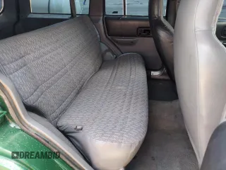 1998 Jeep Cherokee Sport with VIN 1J4FJ68SXWL210381, listed as a Copart auction lot 58398995 with 211,870 mi miles and Salvage title. Bid and sale history available at DreamBid. Image 11.