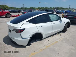 2023 Tesla Model Y Long Range with VIN 7SAYGDEE7PF865539, listed as a IAAI auction lot 42109673 with 34,923 mi miles and . Bid and sale history available at DreamBid. Image 4.