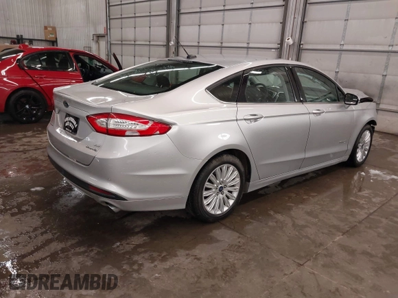 2016 Ford Fusion SE Hybrid z VIN 3FA6P0LU1GR304166, wystawiony jako IAAI lot #41932720 z przebiegiem 68 058 mil mil oraz . Historia ofert i sprzedaży dostępna na DreamBid. Obrazek 4.