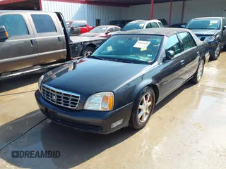 2001 Cadillac DeVille DHS z VIN 1G6KE57YX1U190955, wystawiony jako IAAI lot #41941668 z przebiegiem 191 040 mil mil oraz . Historia ofert i sprzedaży dostępna na DreamBid. Obrazek 2.