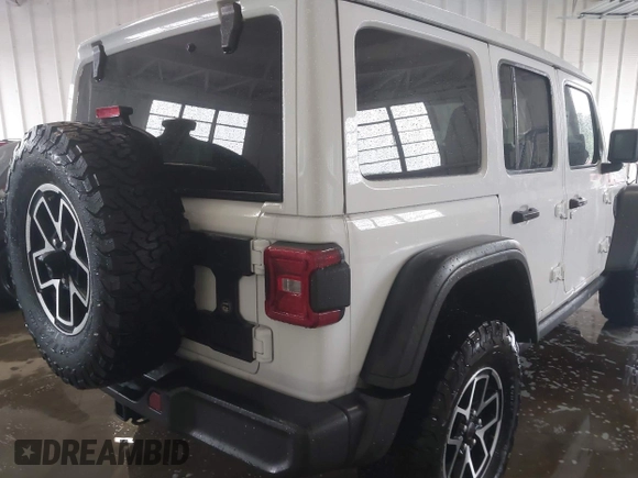 2024 Jeep Wrangler Rubicon with VIN 1C4PJXFG7RW334190, listed as a IAAI auction lot 42332948 with 14,272 mi miles and . Bid and sale history available at DreamBid. Image 4.