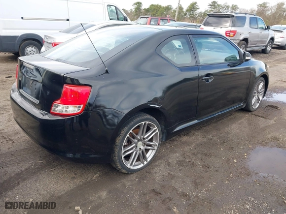 2011 Scion tC with VIN JTKJF5C74B3014552, listed as a IAAI auction lot 42004369 with 232,588 mi miles. Bid and sale history available at carsss.com. Image 4.