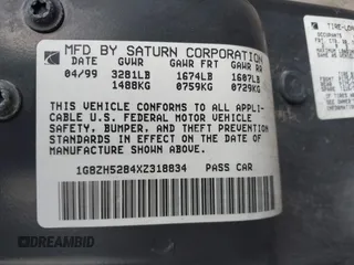 1999 Saturn SL with VIN 1G8ZH5284XZ318834, listed as a IAAI auction lot 41486518 with 178,227 mi miles. Bid and sale history available at carsss.com. Image 9.